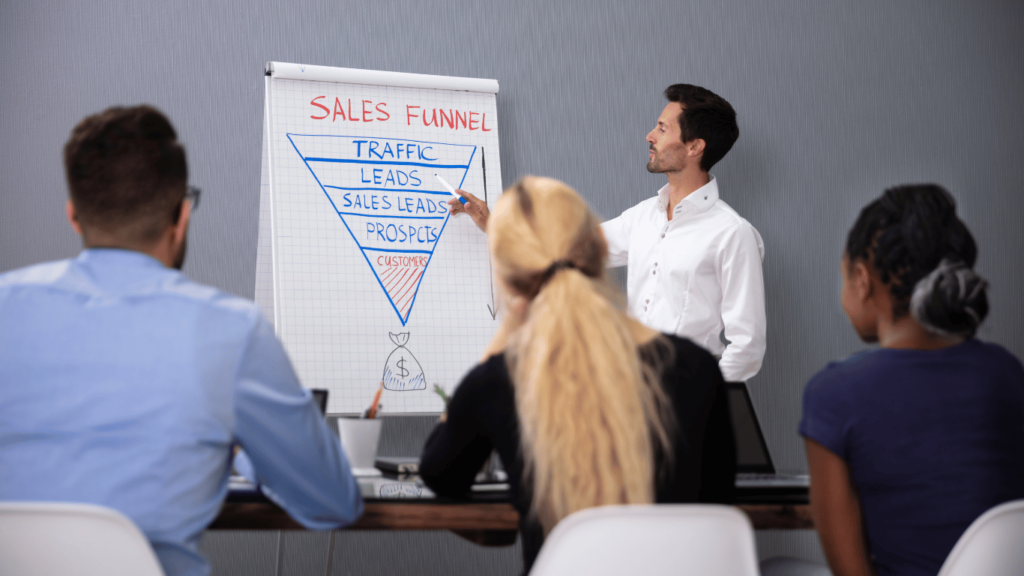 Sales team studying sales funnel and checking key sales metrics