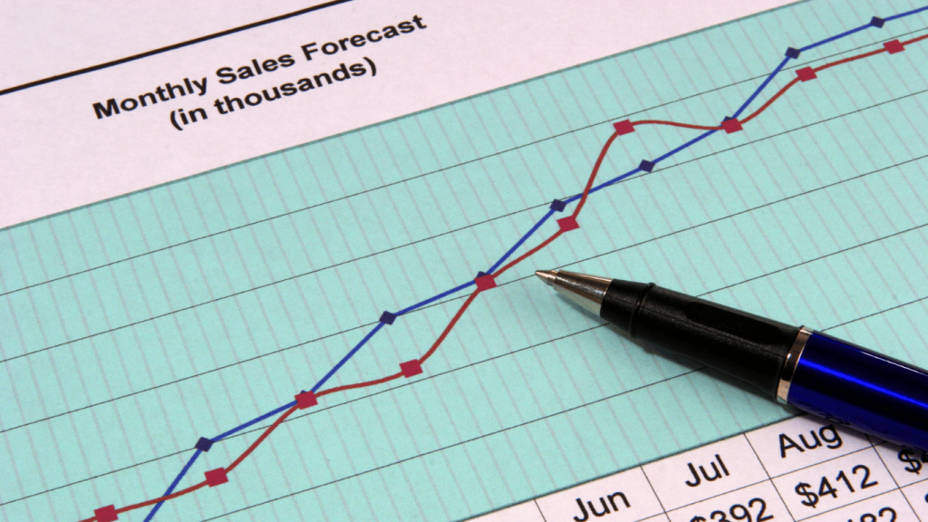 An image showing sales leads working on a sales forecast